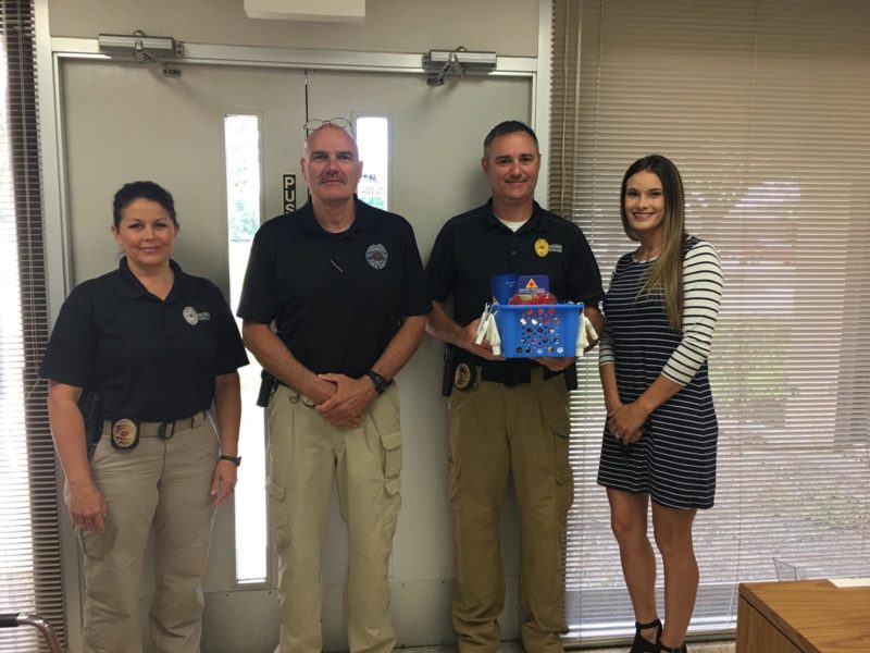 Port Neches PD poses with our marketing team for National Police Week. 