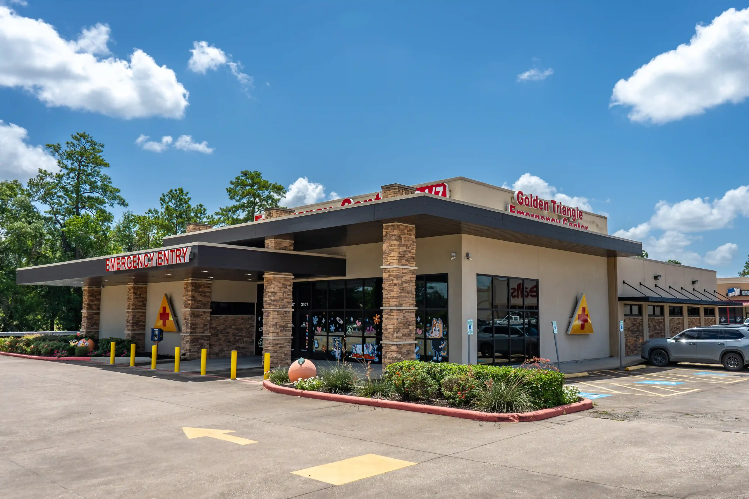 Exterior of Golden Triangle Emergency Center with a clearly marked emergency entrance and parking area.